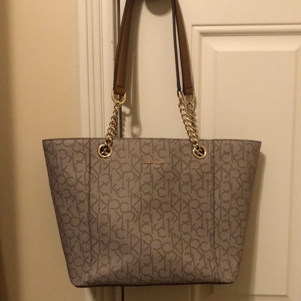 Calvin Klein signature logo tan tote with camel/chain straps.